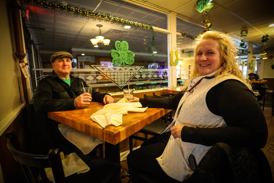 Image of a couple enjoying a drink together during dinner at Lynch's on the Green